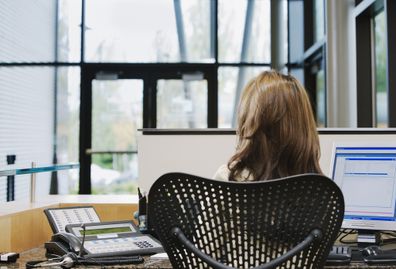 Receptionist sitting at desk