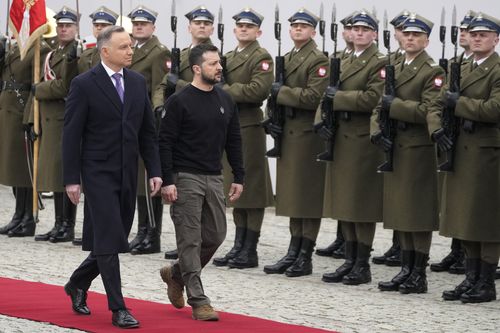 Poland's President Andrzej Duda, left, welcomes Ukrainian President Volodymyr Zelenskyy as they meet at the Presidential Palace in Warsaw, Poland, Wednesday, April 5, 2023. 