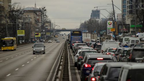 Residents seeking to leave the capital are stuck in traffic on a highway in Kyiv, Ukraine.