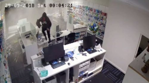 The thief was seen jumping over debris to steal boxes of medication.