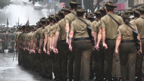 Members of the Australian Defence Forces (ADF) march during an Anzac Day parade on April 25, 2022 in Brisbane, Australia