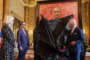 King Charles III and Queen Camilla at the unveiling of artist Jonathan Yeo&#x27;s portrait of the King, in the blue drawing room at Buckingham Palace, in London, Tuesday May 14, 2024.  