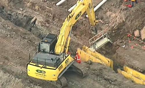 A worker has died after falling into a trench at a construction site north of Melbourne.

