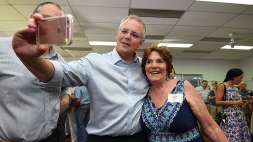  Prime Minister Scott Morrison takes a selfie with a supporter during a CWA hall meeting in Maroochydore on the Sunshine Coast.