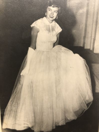 Rosalind Carrodus attending the royal banquet in her wedding gown, 1954.