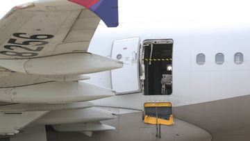 An Asiana Airlines plane is parked as one of the plane&#x27;s doors suddenly opened at Daegu International Airport in Daegu, South Korea, Friday, May 26, 2023. 