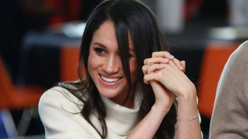 Meghan Markle wears her baptism bracelet. 