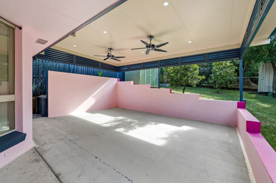 A three-bedroom family home with a very unusual pink graffiti art exterior has gone on the market and is expected to sell for just under $1million