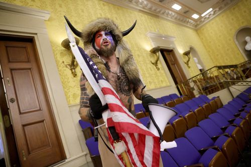 'QAnon Shaman' Jacob Chansley was among a group of hundreds of pro-Trump supporters who stormed the US Capitol.