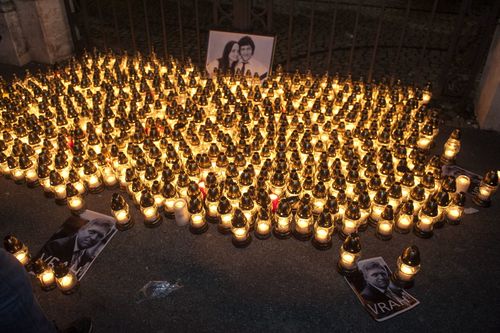 Hundreds of people gathered in the centre of Bratislava, Slovakia, February 28, 2018, carrying burning candles in commemoration of journalist Jan Kuciak and his girlfriend, who were murdered last week. The rally set off from the central SNP Square to the government seat. Further commemorative meetings are to take place in towns across Slovakia on Friday and Saturday, organised by civic activists. Photo/Martin Mikula (CTK via AP Images)