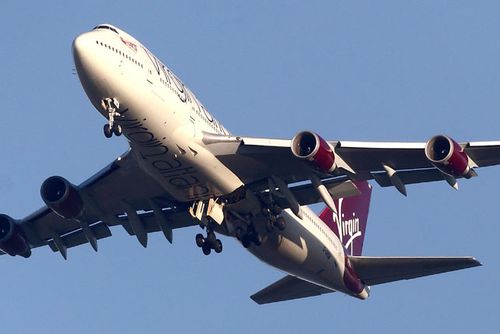A detailed view of the undercarriage of the Virgin Atlantic Boeing 747 as it passed overhead at Gatwick where it made several flybys of the airport to asses the damage. (Getty) 