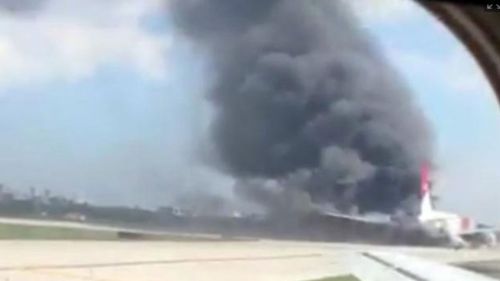 A passenger on another flight filmed the fire from his seat. (Mike Dupuy)