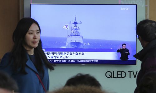 A TV screen shows file footage of a South Korean warship during a news program at the Seoul Railway Station in Seoul, South Korea, Wednesday, Jan. 23, 2019. South Korea's military accused Japan of a "clear provocation" over what it said was a threatening low-altitude flight by a Japanese patrol plane over a South Korean warship on Wednesday. 
