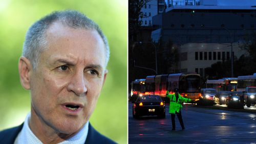 Premier Jay Weatherill (left), and a blackout in Adelaide last September (right). (AAP file image)
