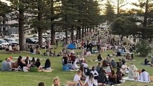 Crowds pack Burleigh Hill on the Gold Coast on Sunday, May 3, forcing police to move people on. Queensland.