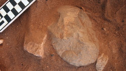 An edge-ground hatched head found at the Madjedbebe rock shelter in the Kakadu National Park in the Northern Territory which is part of new proof showing Aboriginal people lived in Australia up to 18,000 years earlier than once thought  (AAP Image/Gundjeihmi Aboriginal Corporation, Chris Clarkson).