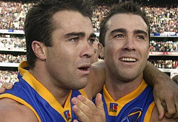 How many AFL premierships did Brad and Chris Scott win together with the Lions?