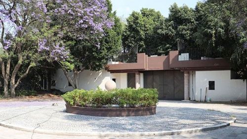 The front driveway entrance gate to the villa