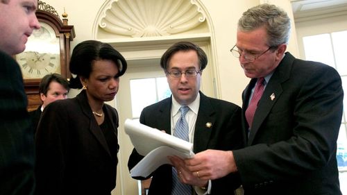 Brett Kavanaugh (second from left) was a powerful behind-the-scenes player in the Bush Administration. (AAP)