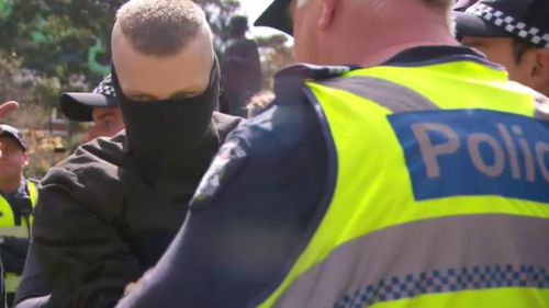 The man was arrested in front of the State Library on Swanston Street. (9NEWS)