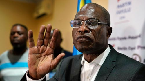 Opposition candidate Martin Fayulu speaks to the press at his headquarters in Kinshasa, Congo.