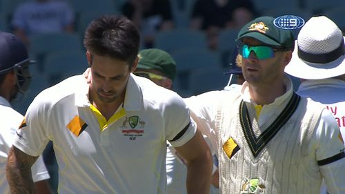 Mitchell Johnson is comforted by Michael Clarke. (9NEWS)