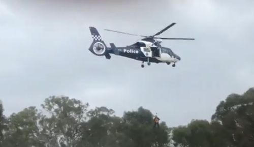 17 people had to be winched to safety from the Hume Freeway south of Wangaratta after their cars were engulfed by flash flood waters.

