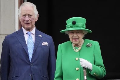 Queen Elizabeth II stands with his son Prince Charles on the balcony during the Platinum Jubilee Pageant outside Buckingham Palace in London, Sunday, June 5, 2022, on the last of four days of celebrations to mark the Platinum Jubilee. 