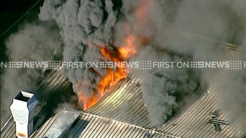 Firefighters battle to contain northern Sydney factory fire