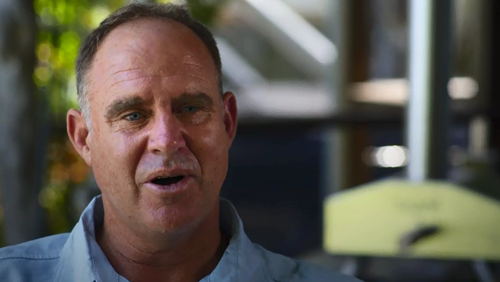 Matthew Hayden was hit for a six when he hit a sand bank while surfing on a family holiday.