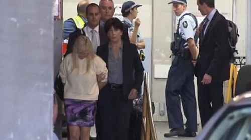 Susan Stewart being led into court. 