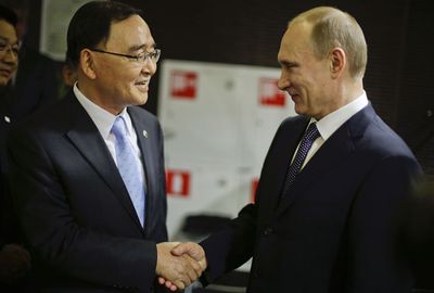 Vladimir Putin (R) was praised for showing a new Russia.