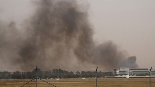 Flights in and out of Canberra airport have been grounded as two bushfires burn in the ACT.
