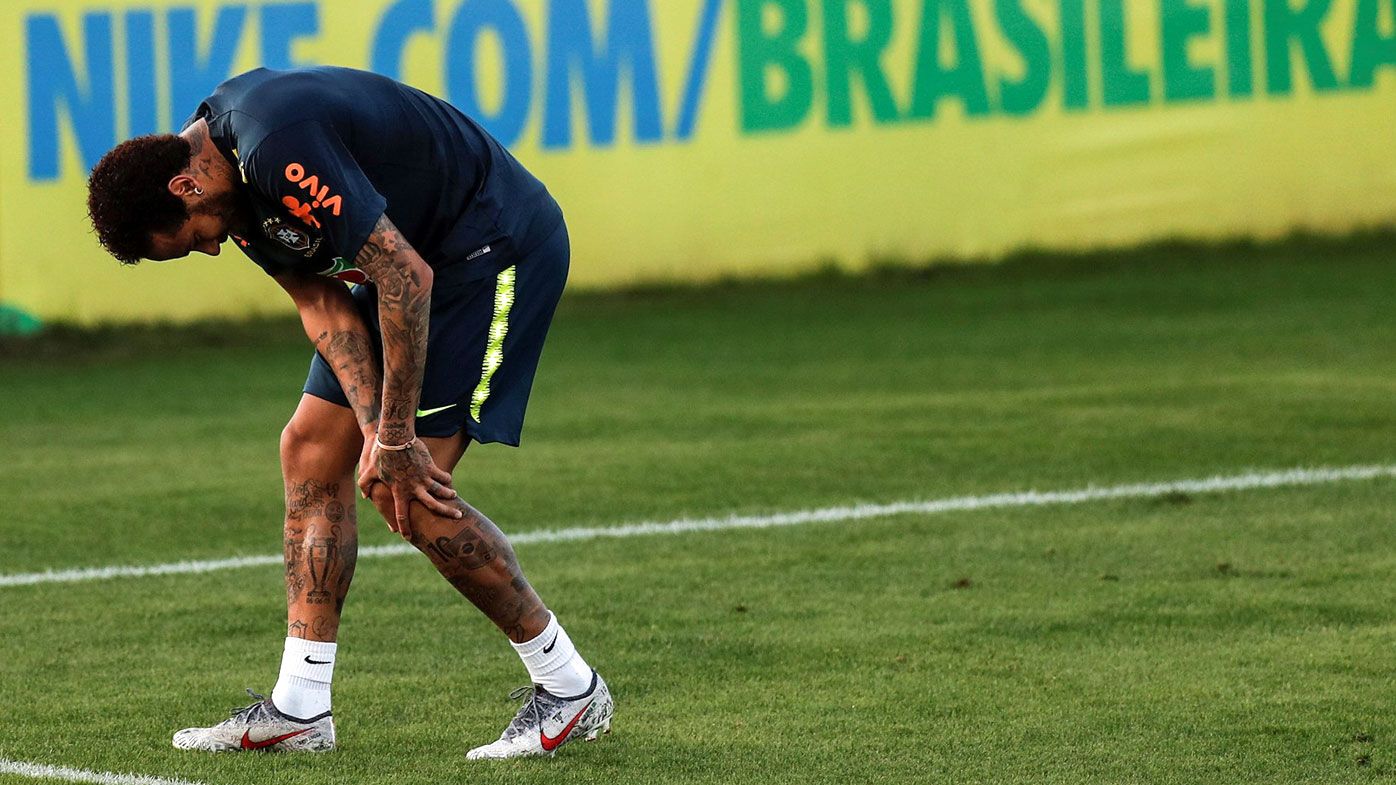 Brazilian national soccer team player Neymar Jr. reacts during a training session 