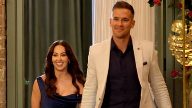 MAFS 2024 Ellie and Jonathan walk into the Reunion Dinner Party hand-in-hand.