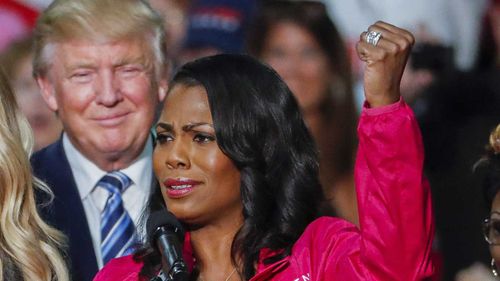 Donald Trump listens to Omarosa Manigault-Newman. (AAP)