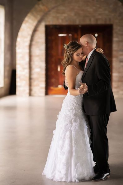 Daughters stage wedding dance with their dying father