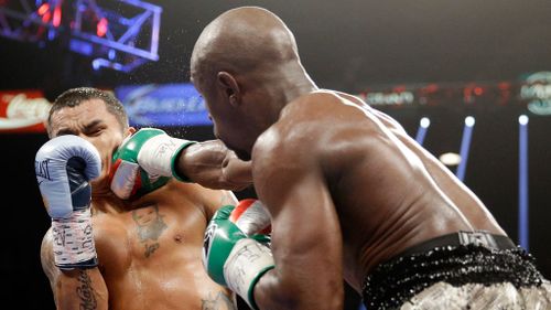 Floyd Mayweather punches Marcos Maidana, left, during their WBA welterweight and WBC super welterweight title fight in Las Vegas. (AAP)