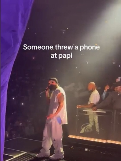 Drake being hit by a fan's phone