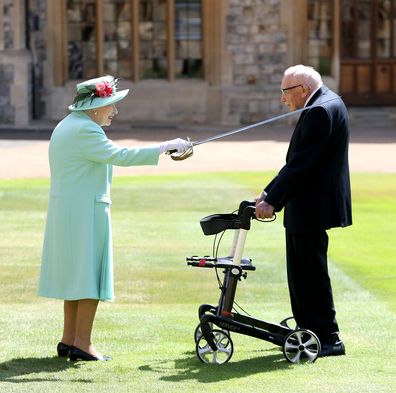 Queen Elizabeth II awards Captain Sir Thomas Moore with the insignia of Knight Bachelor at Windsor Castle on July 17, 2020 in Windsor, England.   (Photo by Chris Jackson/Getty Images)