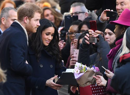 Harry and Meghan meet the public on their walkabout in Nottingham last Friday night. Picture: AAP