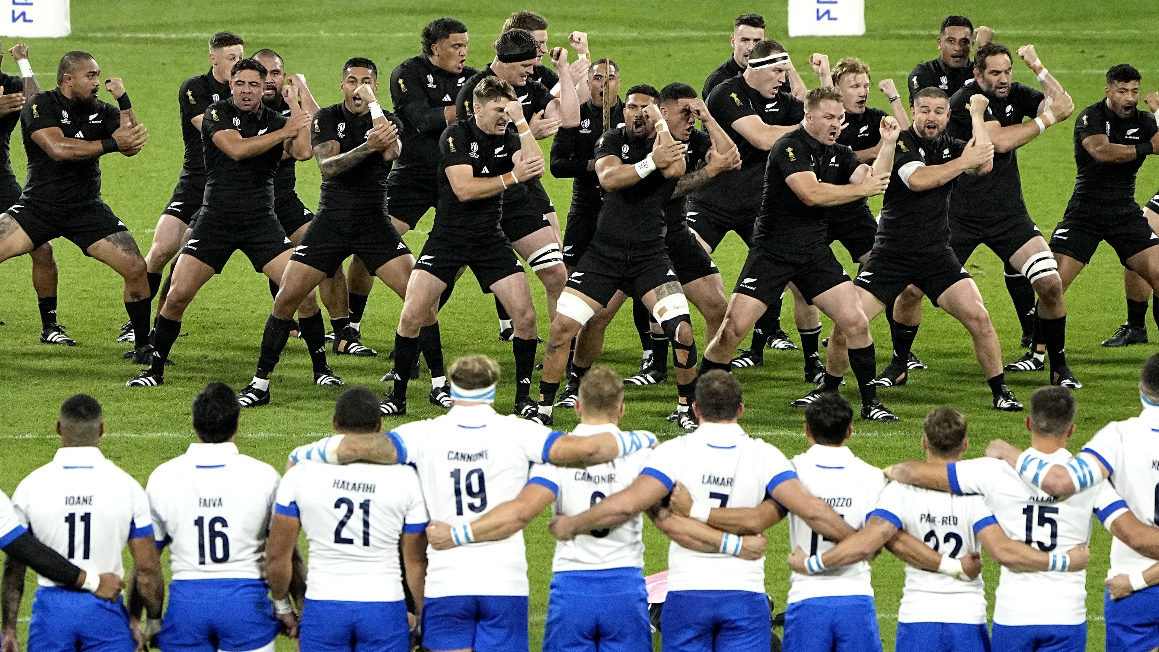 New Zealand players perform the haka during the Rugby World Cup match against Italy.