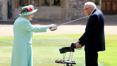 Queen Elizabeth II awards Captain Sir Thomas Moore with the insignia of Knight Bachelor at Windsor Castle on July 17, 2020 in Windsor, England.   (Photo by Chris Jackson/Getty Images)