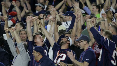 Patriots fans celebrate their team's Super Bowl win. (AAP)