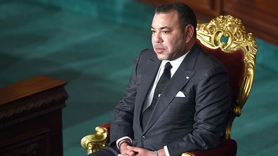 Moroccan King Mohammed VI listens during a session at Tunisia's Constituent Assembly. (Getty)
