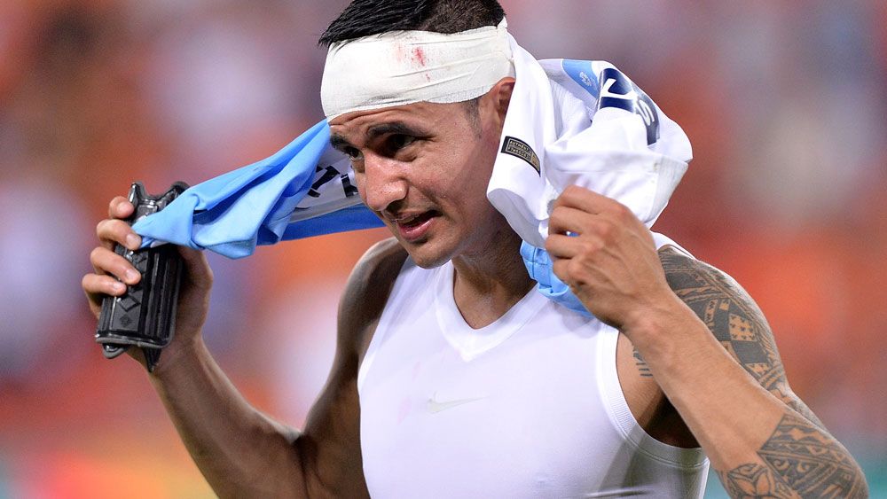 Tim Cahill ended up bloodied and beaten at Suncorp Stadium. (AAP)
