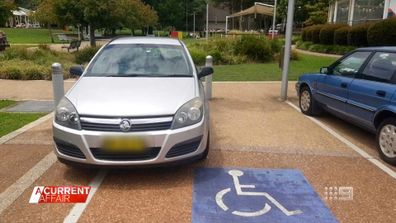 NSW woman was fined $608 for having two wheels inside disabled parking spot while trying to park her car, calling the penalty 'unfair'