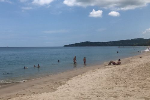 In this March 26, 2020, photo, tourists swim on a beach, Phuket, Thailand. Picture: Penny Wang