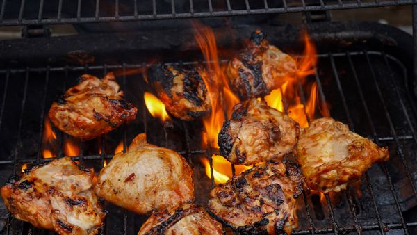 Chicken cooking on a BBQ