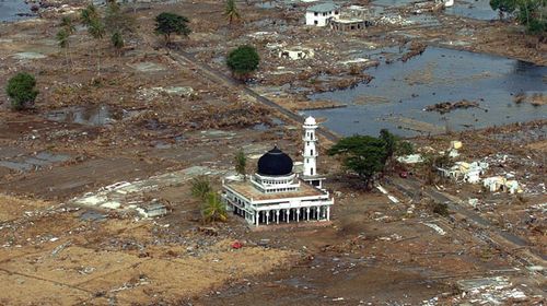 Only a mosque remains among the rubble after the 2004 tsunami. (Getty)